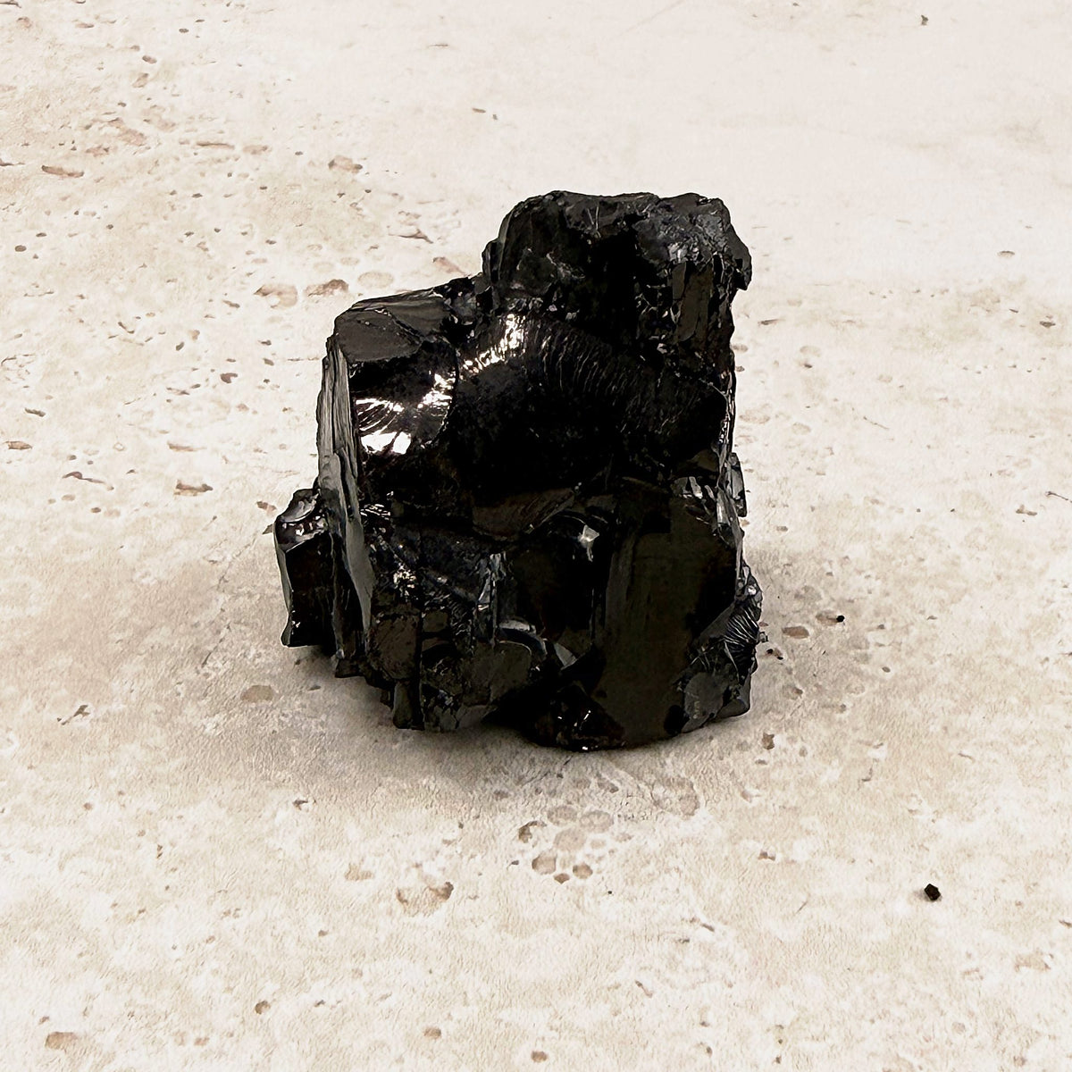 Stout elite shungite rough crystal 4.5cm, chunky upright piece with glossy faces, front view — Eternal Spirit