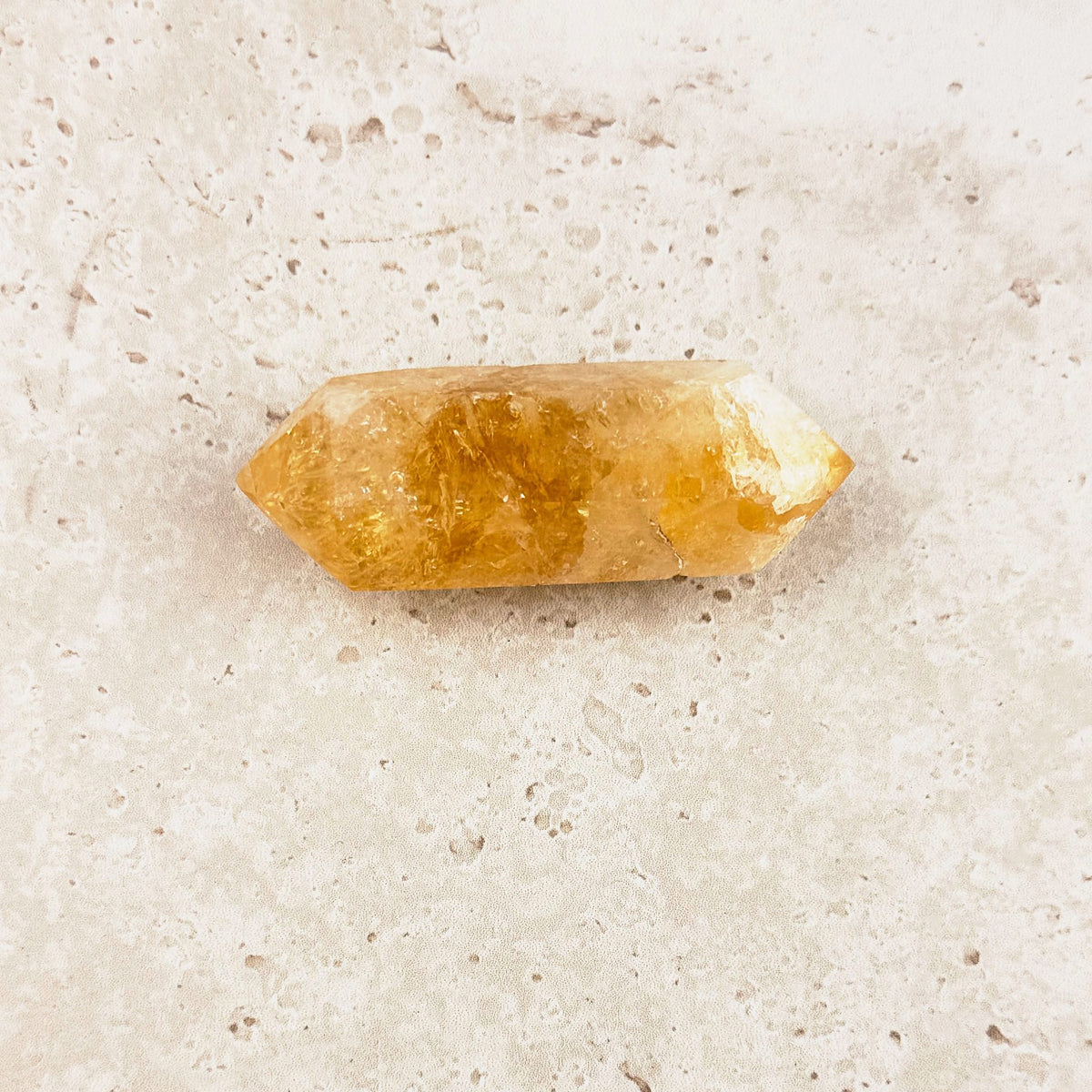 Stout heated citrine crystal wand 7cm, honey gold from tip to tip, double-pointed, side view — Eternal Spirit