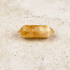 Stout heated citrine crystal wand 7cm, short double-pointed shape, viewed from above — Eternal Spirit