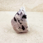 Tall rainbow moonstone crystal freeform 11cm, creamy white with bold dark patches, front view — Eternal Spirit