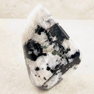 Tall rainbow moonstone crystal freeform 11cm, close view of its polished white and black face — Eternal Spirit