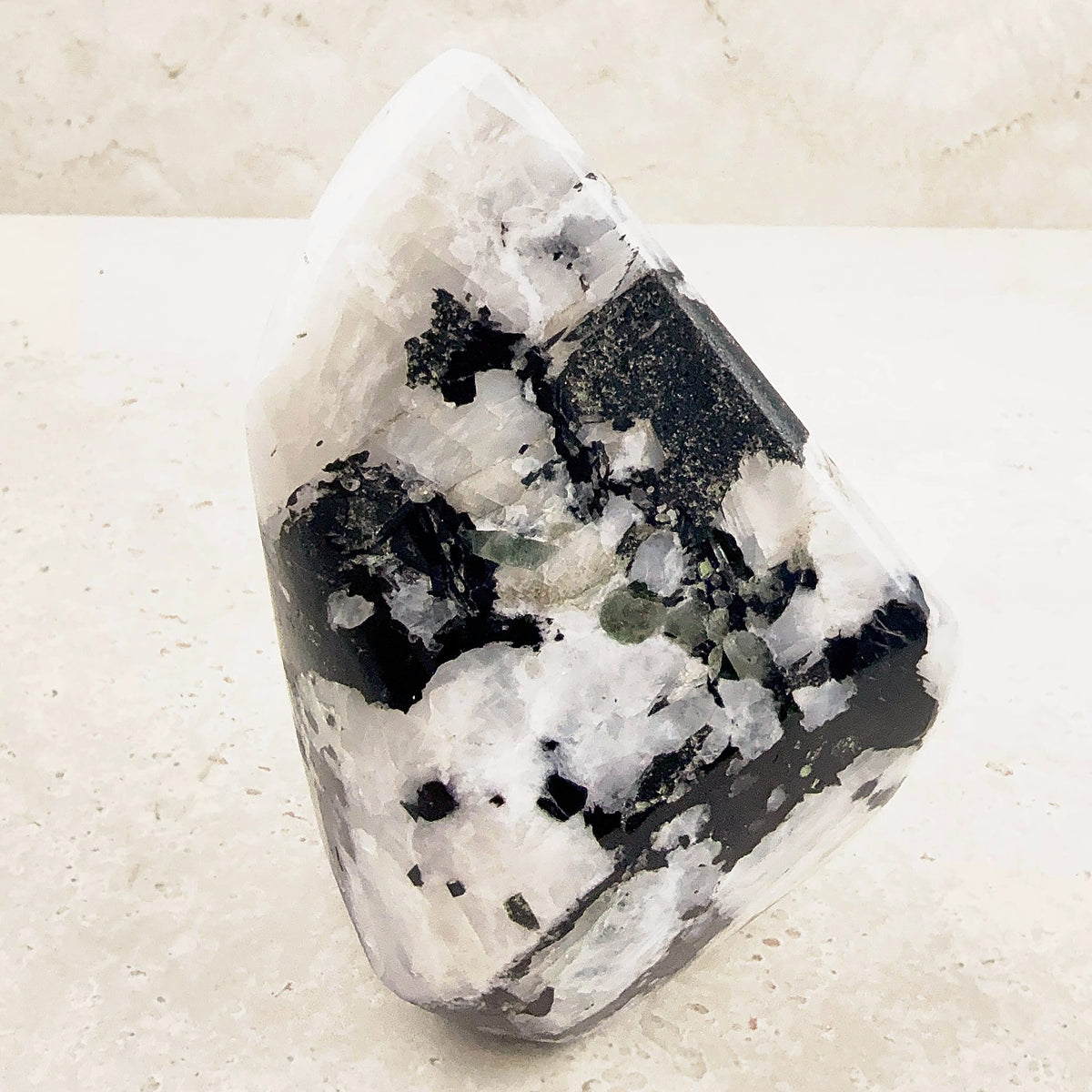 Tall rainbow moonstone crystal freeform 11cm, close view of its polished white and black face — Eternal Spirit