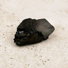 Wedge elite shungite rough crystal 5cm, small black wedge shape, front view — Eternal Spirit