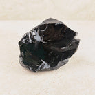Wide black obsidian rough 10cm, curved shell-like breaks with a mirror shine, front view — Eternal Spirit