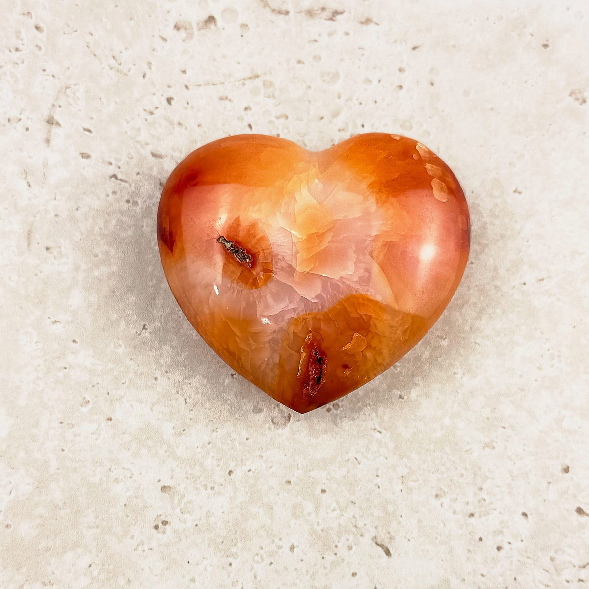 Wide carnelian crystal heart 6.5cm, glowing orange with fine white lines, viewed from above — Eternal Spirit