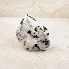 Wide rainbow moonstone crystal freeform 9cm, milky white with dark streaks, front view — Eternal Spirit